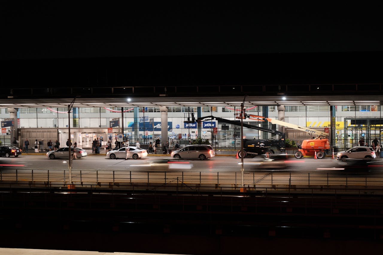 Long exposure captures bustling activity at Chicago O'Hare Airport during nighttime.